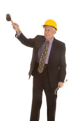 elderly man suit hardhat lift tool