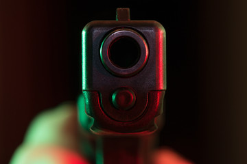 Point blank gun lit with red and green lights