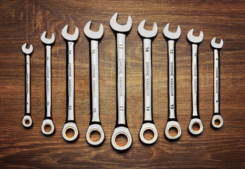 Set of wrenches on wood