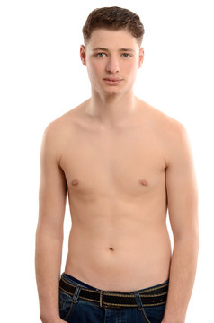 Chubby young man standing topless.Man with no fitness muscles.