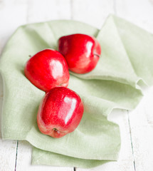 Fresh farm raised apples on rustic wooden background