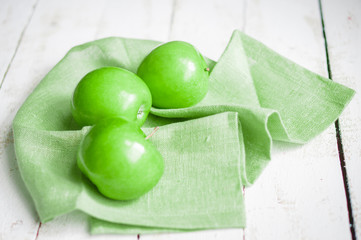 Fresh farm raised apples on rustic wooden background