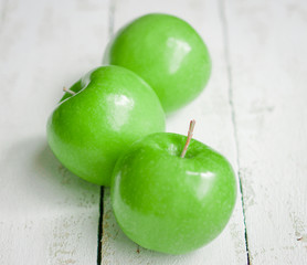 Fresh farm raised apples on rustic wooden background
