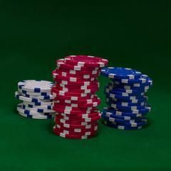 Casino chips on green table