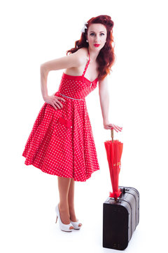 Beautiful pin-up girl with suitcase and umbrella