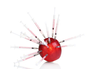 red apple and syringes isolated on white