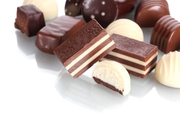Many different chocolate candy isolated on white