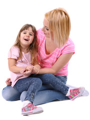 Pretty little girl with mother isolated on white