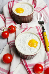 Baked eggs on table close up