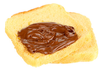 Bread with sweet chocolate hazelnut spread isolated on white