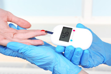 Measuring glucose level blood in hospital close-up