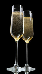 Glasses of champagne, on black background