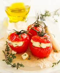 Baked tomatoes stuffed with cheese.