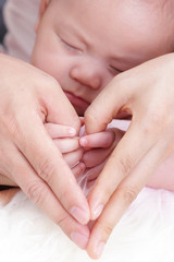 lovely baby with Mam use hand