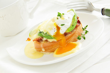 Breakfast. Poached egg with hollandaise sauce,