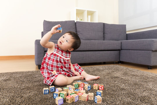 Asian Baby Girl Playing Toy Block