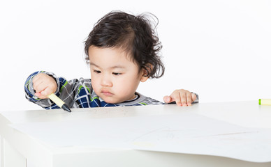 Little boy concentrate on drawing