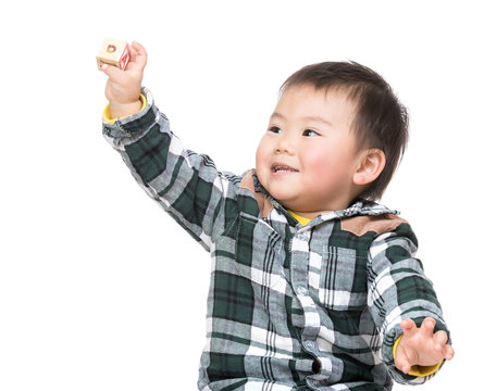 Asian Baby Holding Toy Block