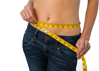 Slim woman measuring her waist