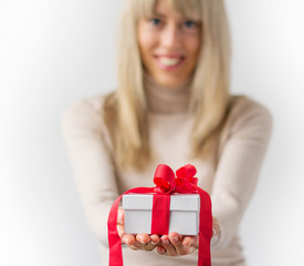 Woman giving present in white box