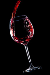 Red wine on black background