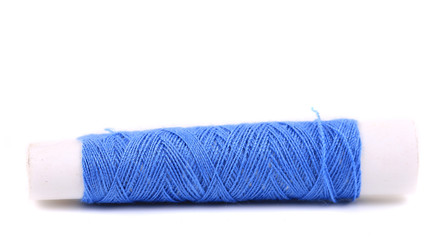 Blue coil of threads close up.