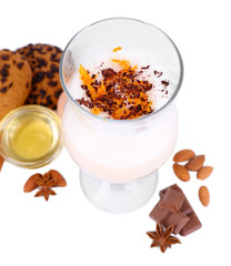 Eggnog with spices and orange isolated on white