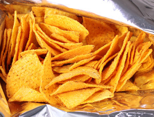 tasty potato chips in bag close up