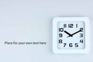 Office clock on color wall background