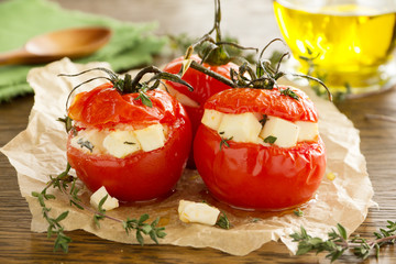 Baked tomatoes stuffed with cheese.