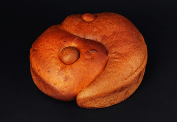 Loaf of bread on black background