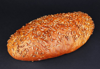 Loaf of bread on black background