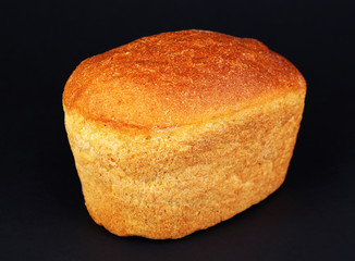 Loaf of bread on black background