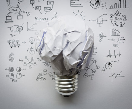 Crumpled Paper Light Bulb With Drawing Graph