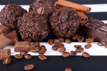 Delicious chocolates on table close-up