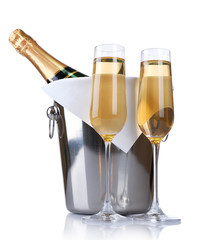 Glasses of champagne and bottle in pail, isolated on white