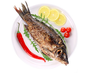 Fried fish on a white plate