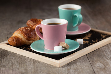 Coffee cups and croissants