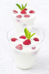 panna cotta with fresh raspberries, vertical close-up