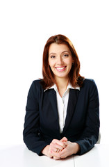 Cheerful businesswoman sitting at the table 