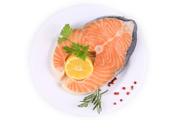 Fresh salmon steak with lemon and pepper.