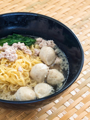 Eating instant noodle with minced pork and pork ball