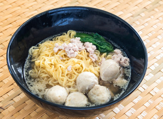 Eating instant noodle with minced pork and pork ball