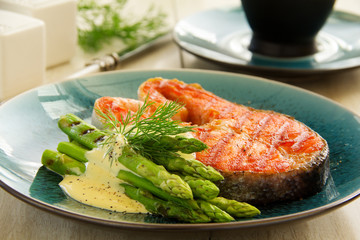 Grilled salmon steak with asparagus.