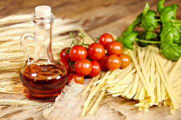 Raw pasta,vegetables ,olive oil and spices