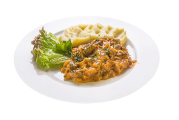 Stew in vegetable sauce with mashed potatoes