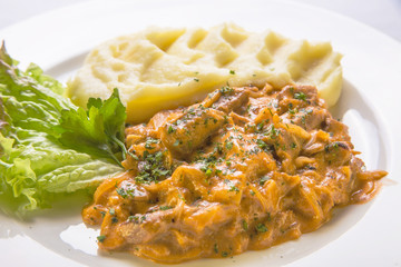 Stew in vegetable sauce with mashed potatoes