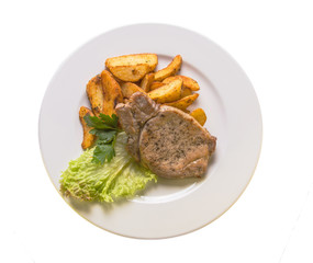 pork chops with potatoes on a white plate