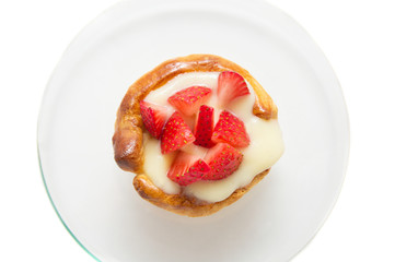 tart with custard and strawberry, isolated, top view