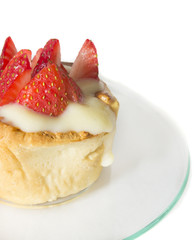 mini tart with custard and strawberry, isolated, side view